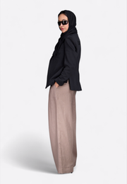 Model wearing classic black cotton blazer, East Vibe